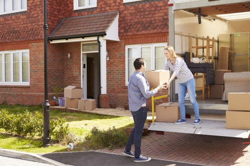 Removal team handling boxes during a Clapham home move