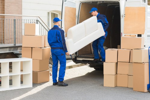 House movers preparing a Clapham home removal with boxes and furniture