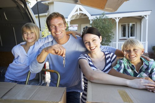 Professional movers handling furniture in a residential property