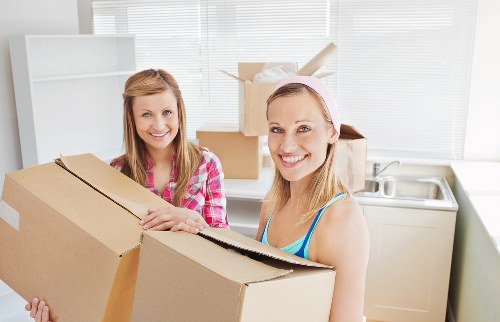 Packed boxes and furniture prepared for removal truck loading